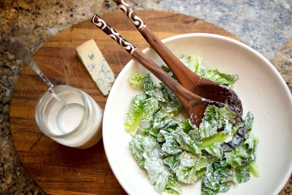 Bowl of bleu-cheese-dressed green salad in a bowl
