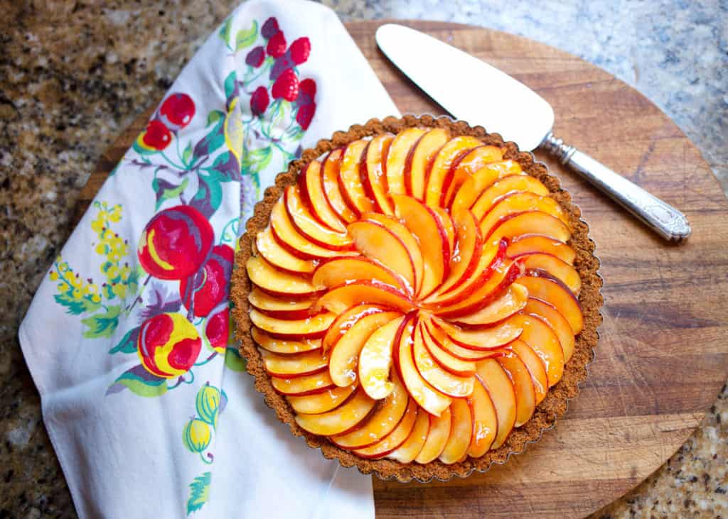 Finished pie with beautiful nectarines arranged on top