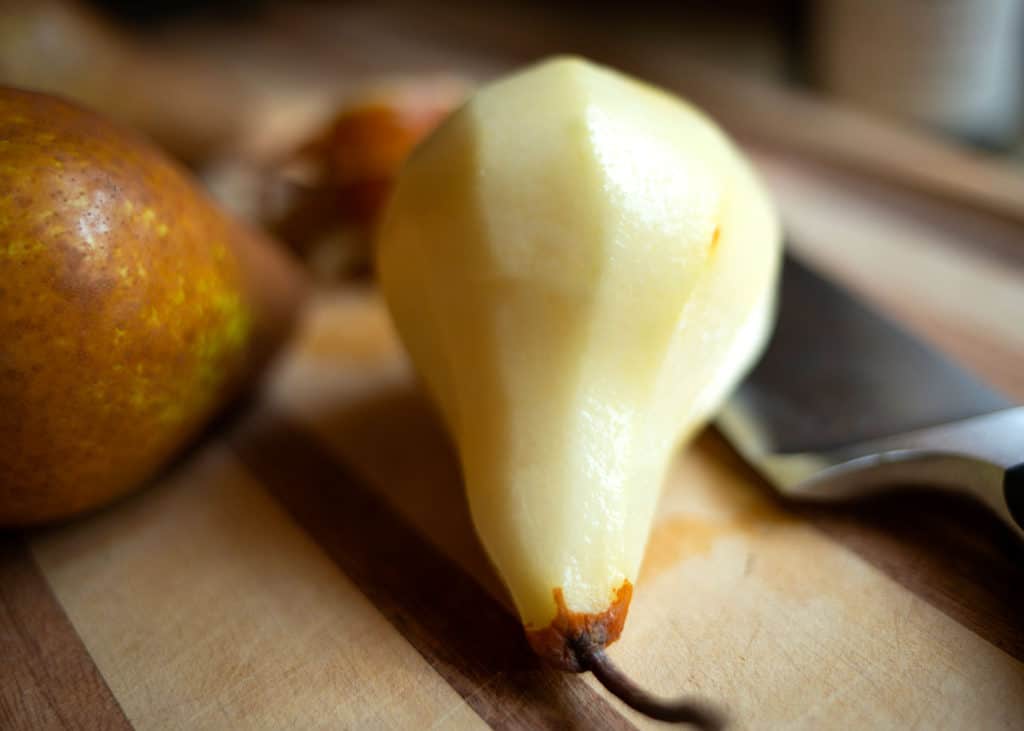 Peeled pear on the cutting board