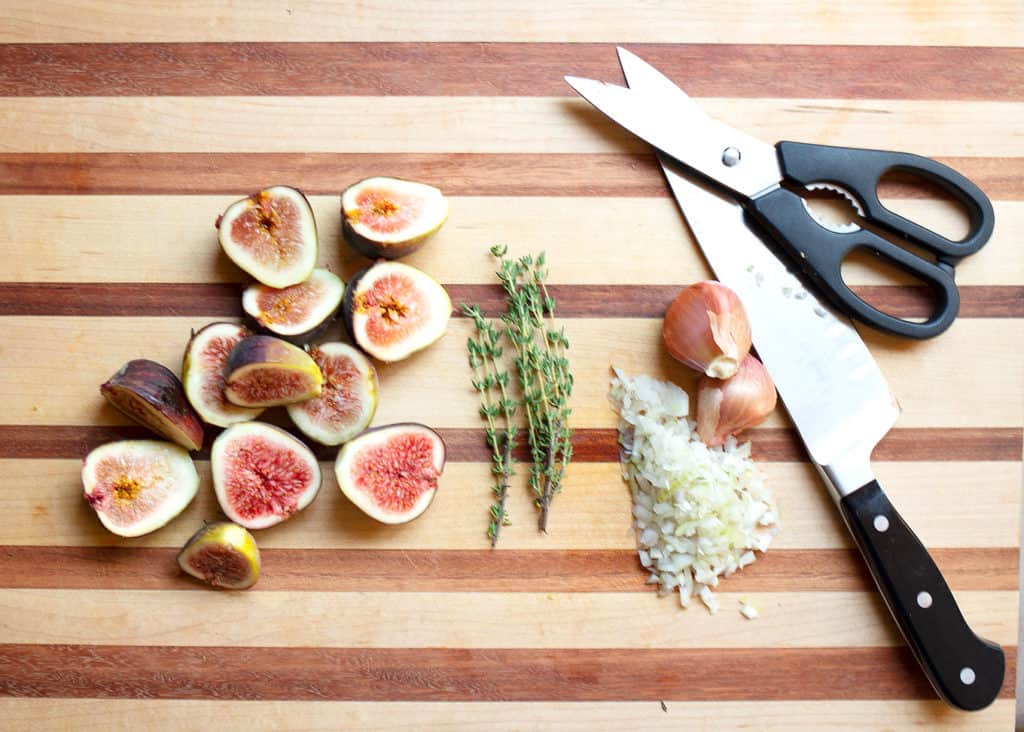 Figs, thyme, shallots on the cutting board