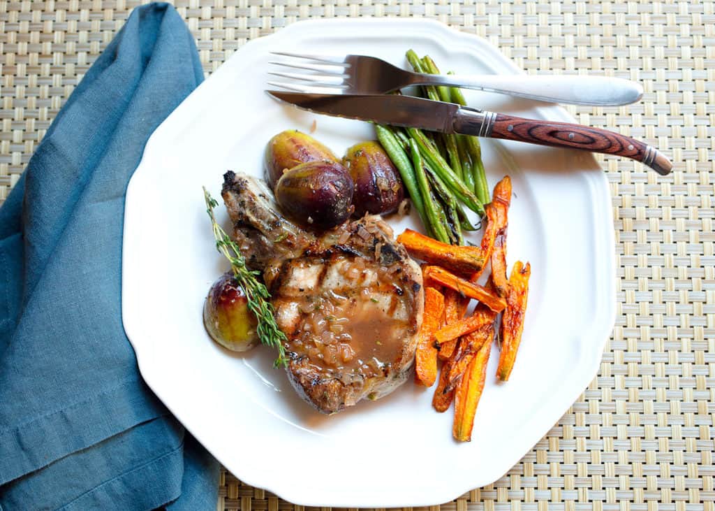 Pork Chop with Marsala Fig Sauce served with roasted carrots and sauteed green beans
