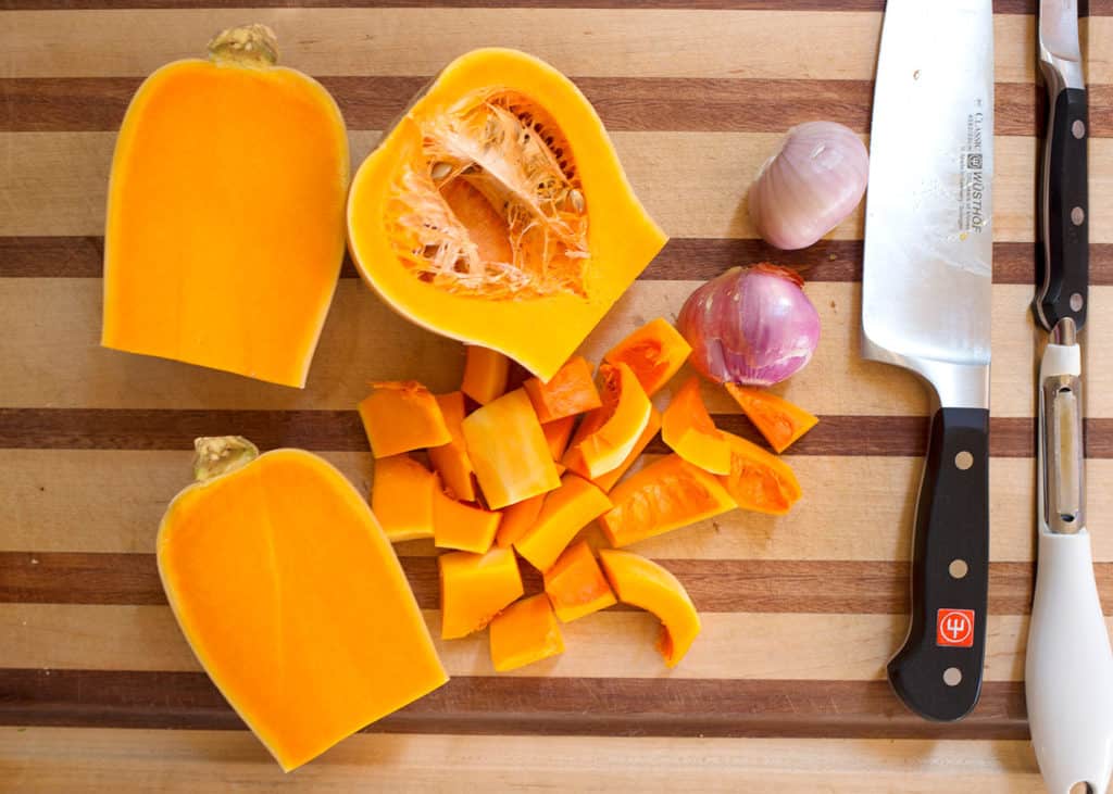 Cut squash to demonstrate how to cut for roasting