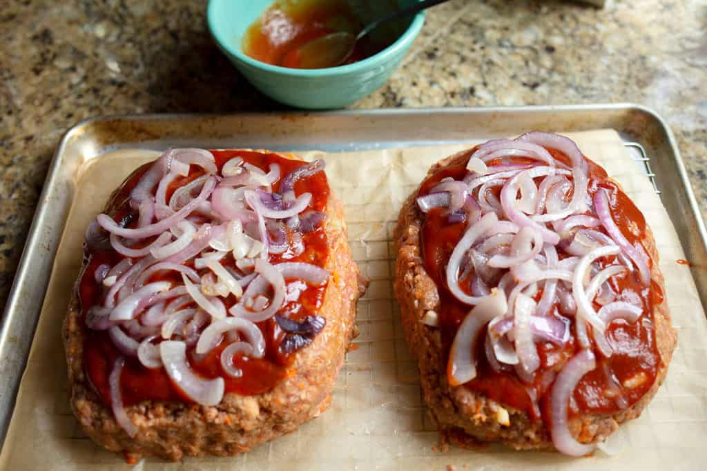 Meatloaf with ketchup mixture and onions on top