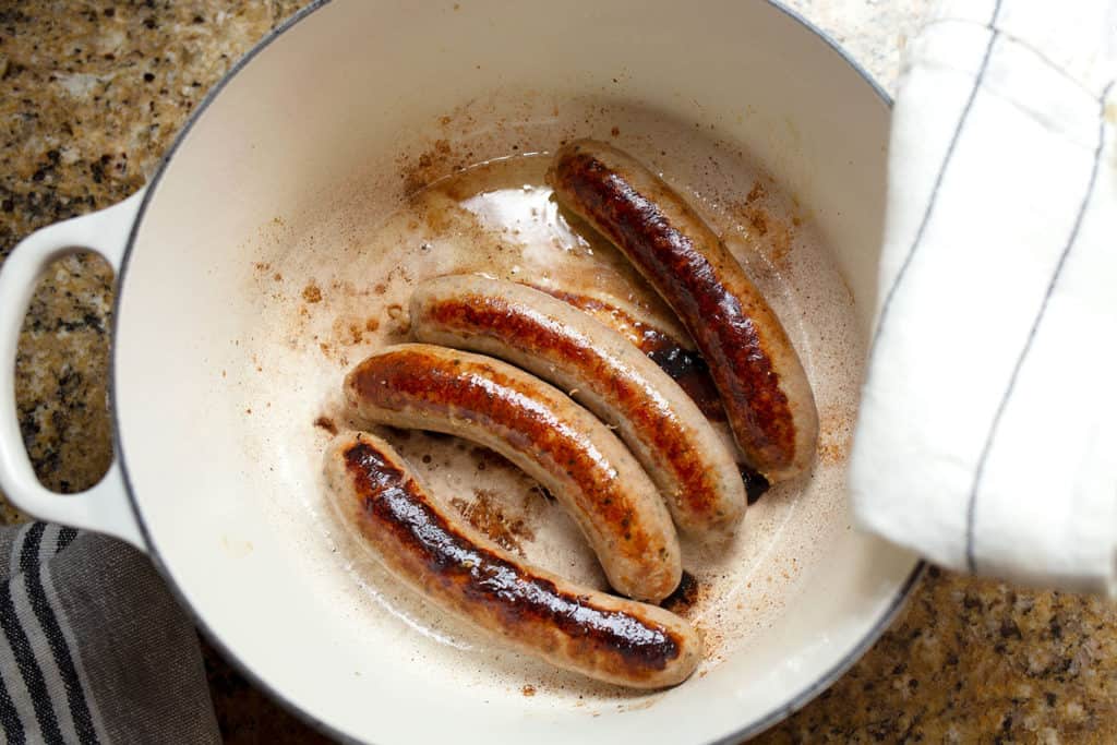 Italian sausages browned in a large pot
