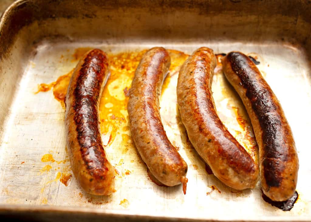 Sauteed sausages finished int he oven and ready to be sliced