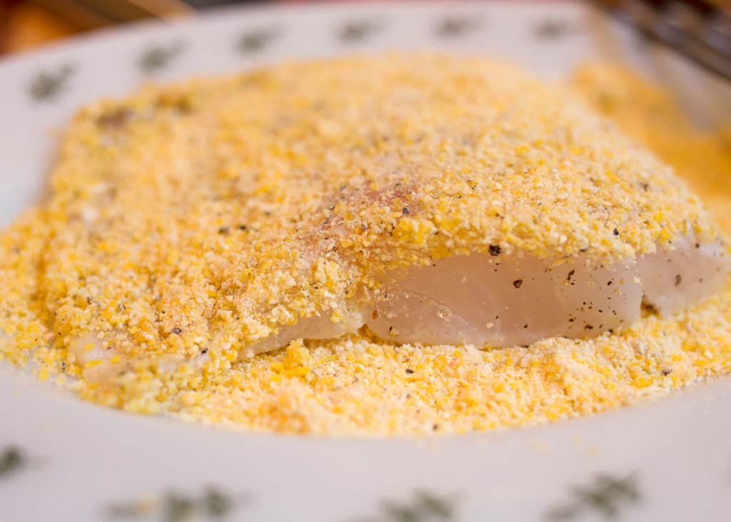 Cod coated in cornmeal ready to cook