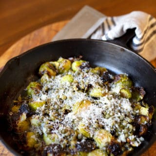 Cast iron skillet with Charred Lemon Caper Brussels Sprouts