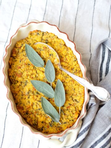Baked Sage Cornbread Dressing with fresh sage leaves on top