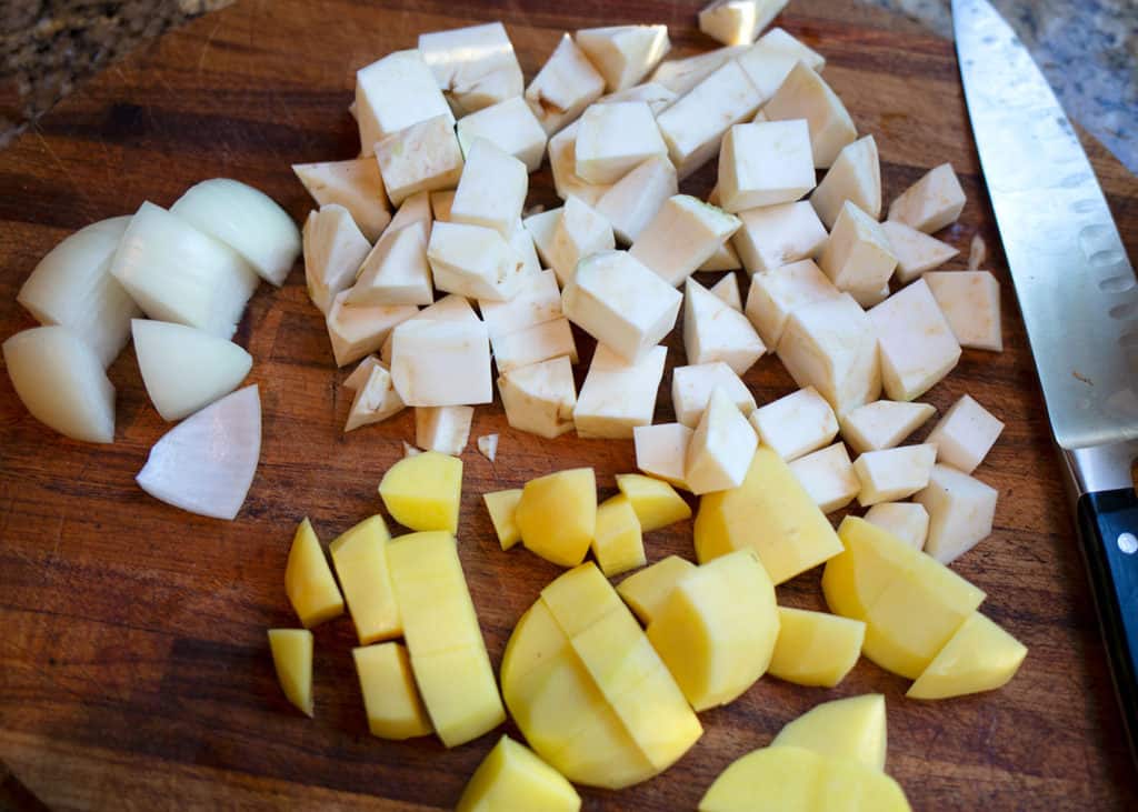 Diced celery root, yukon gold potato, and onion ready to cook