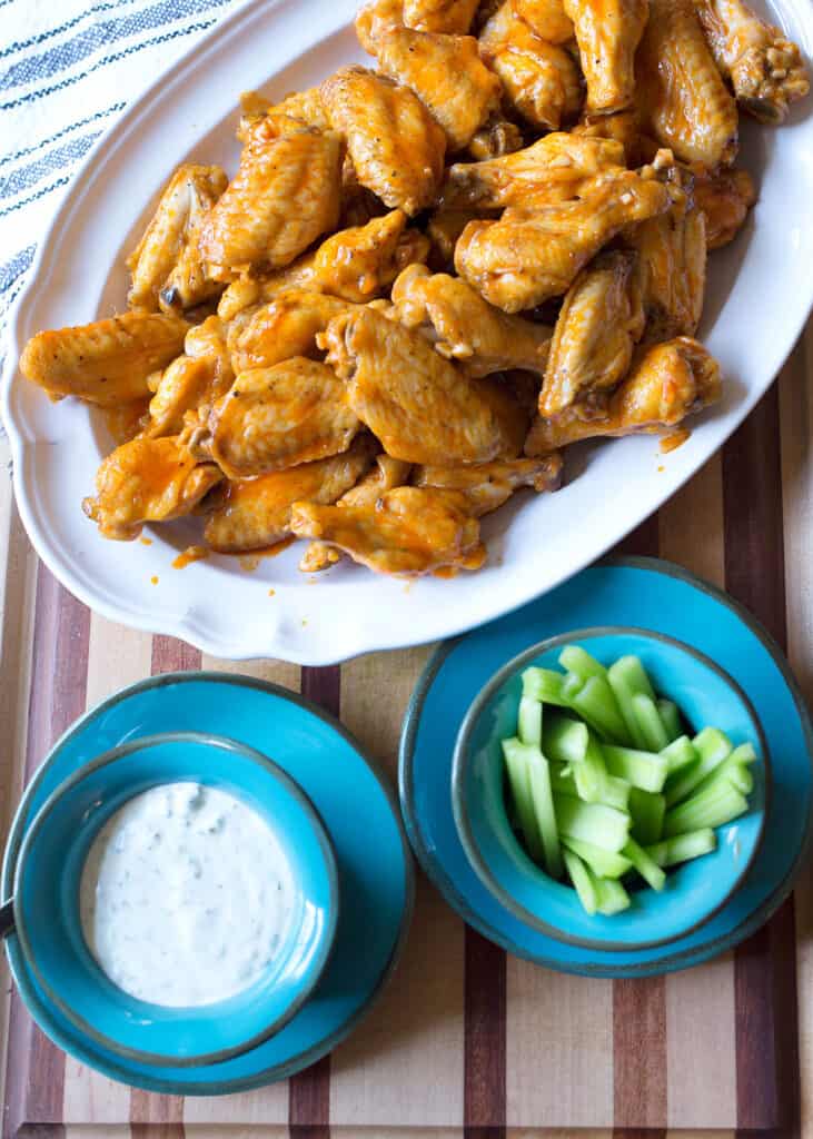 Platter of sauced wings with ranch and celery