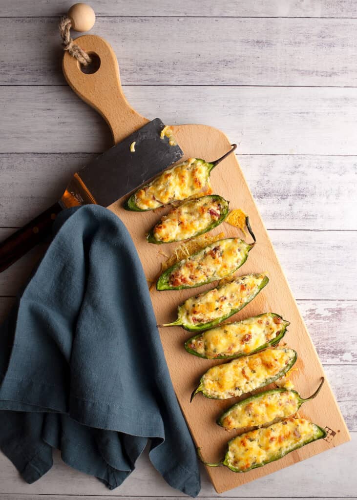 Bacon Jalapeno Poppers on a cutting board ready to eat