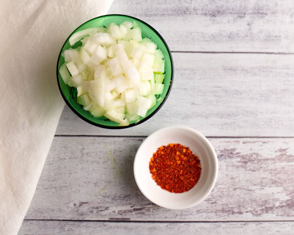onions and red pepper flakes in bowls