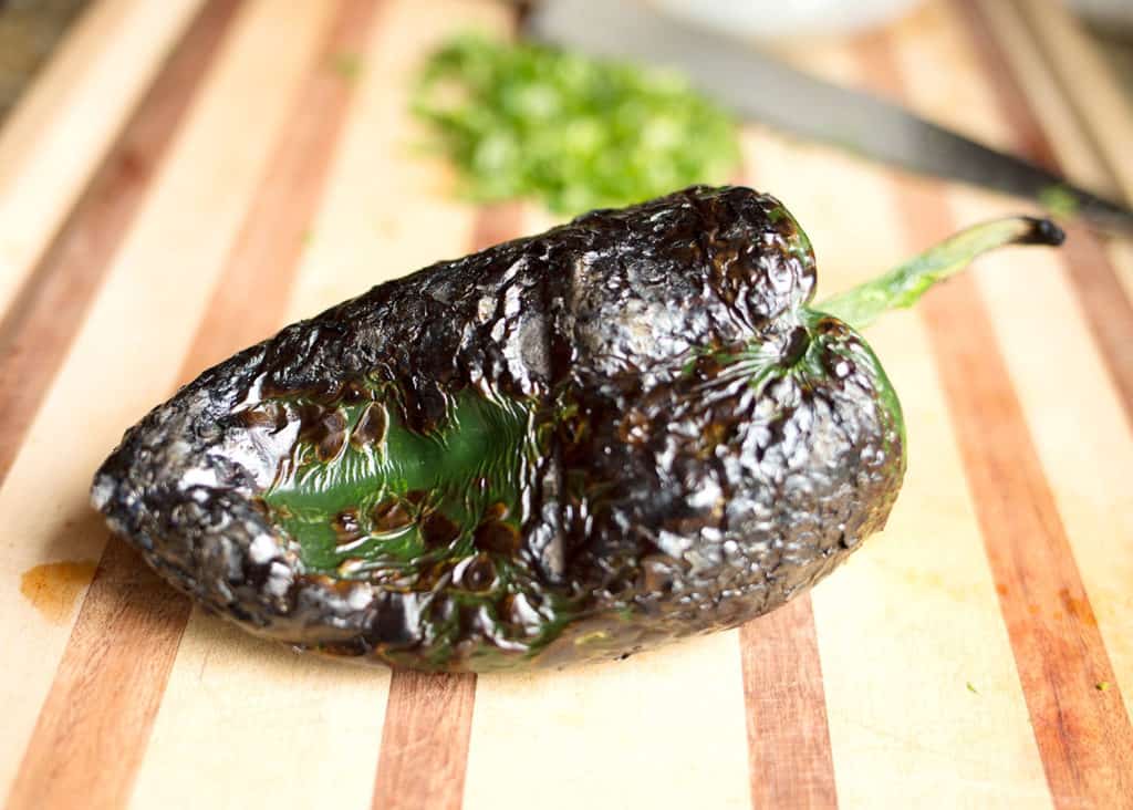 Roasted poblano pepper on the cutting board