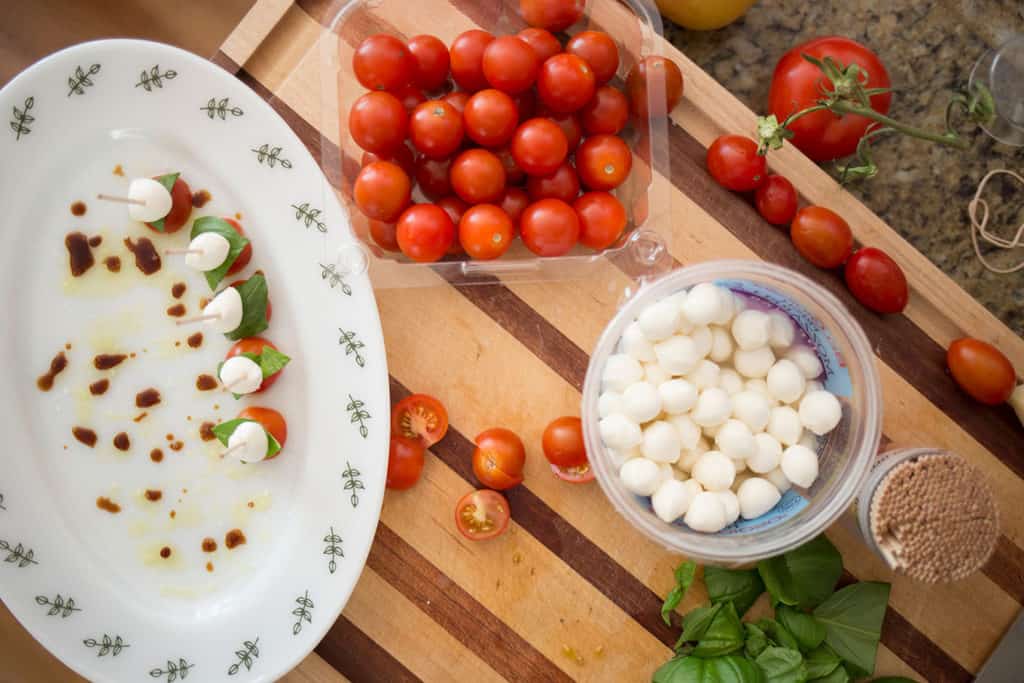 mozzarello balls and cherry tomatoes ready to put on toothpicks
