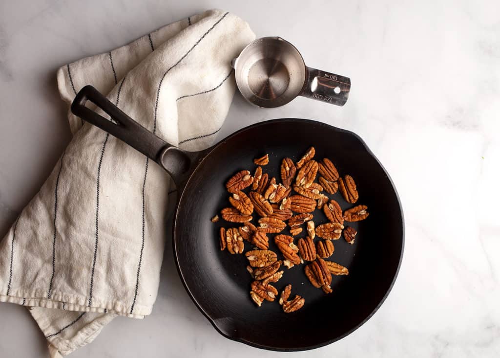 Pecans in a cast iron Chef's skillet to toast