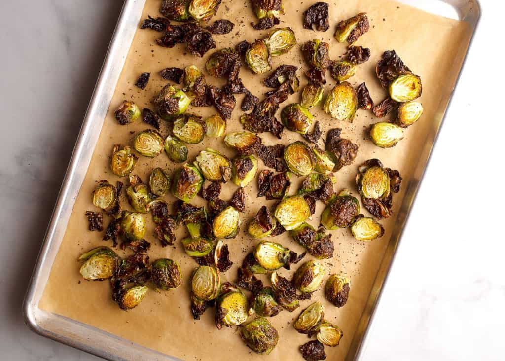 Crispy roasted Brussels Sprouts on a baking sheet