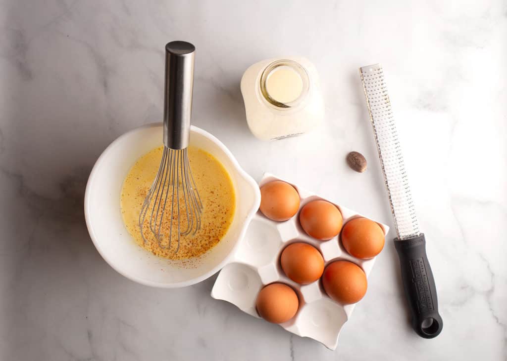 Eggs, cream, and whole nutmeg for the custard