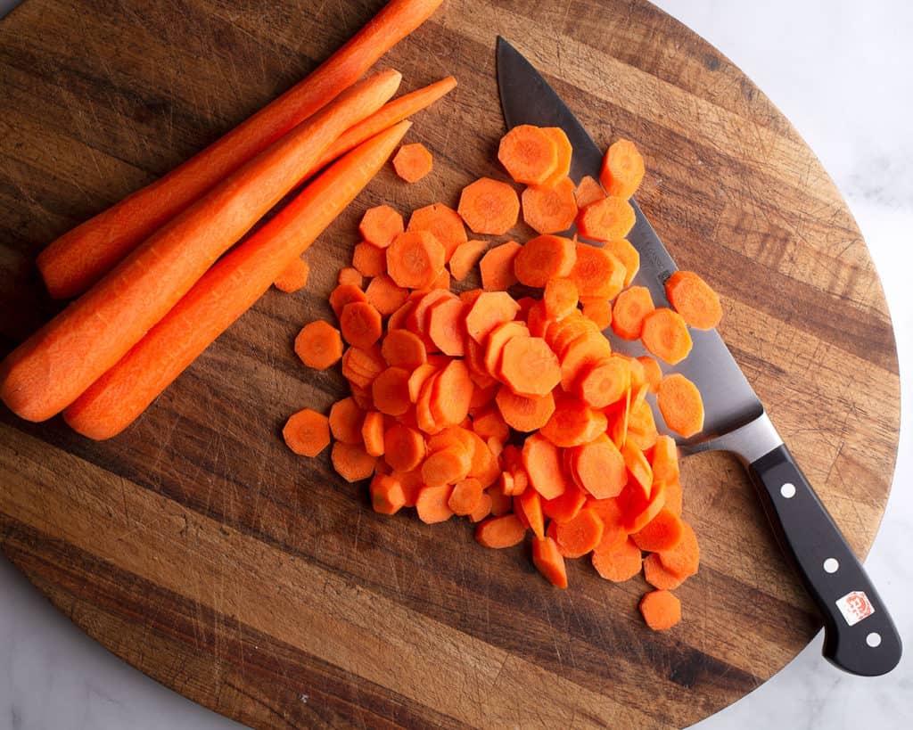 Sliced carrots on cutting board