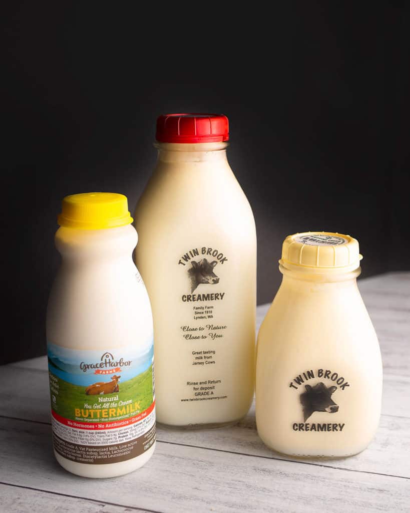 Organic whole milk, cream, and buttermilk in glass bottles