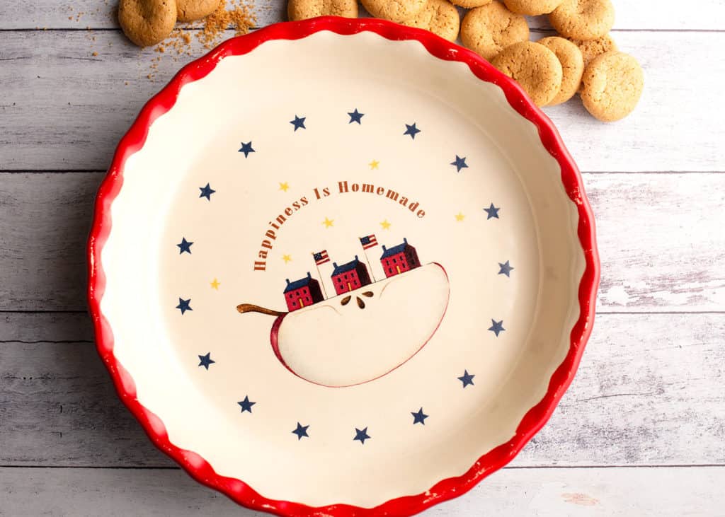 Red-rimmed pie plate with "Happiness is Homemade" quote