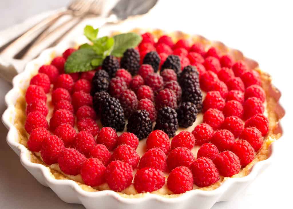 Raspberries on top of the cream filling