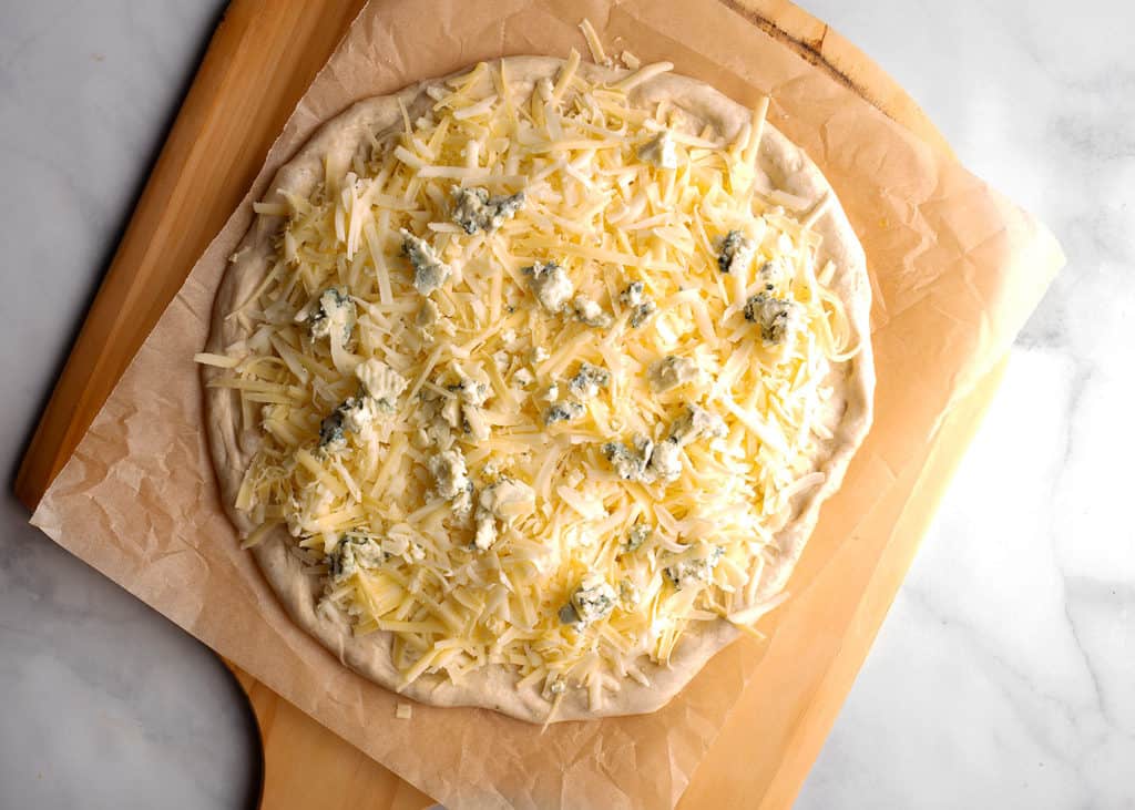 Pizza dough loaded with cheeses
