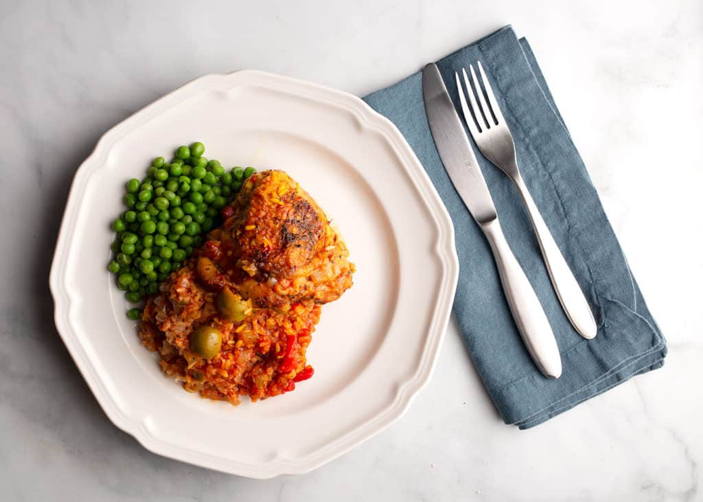 Serving of Baked Saffron Chicken & Rice with green peas