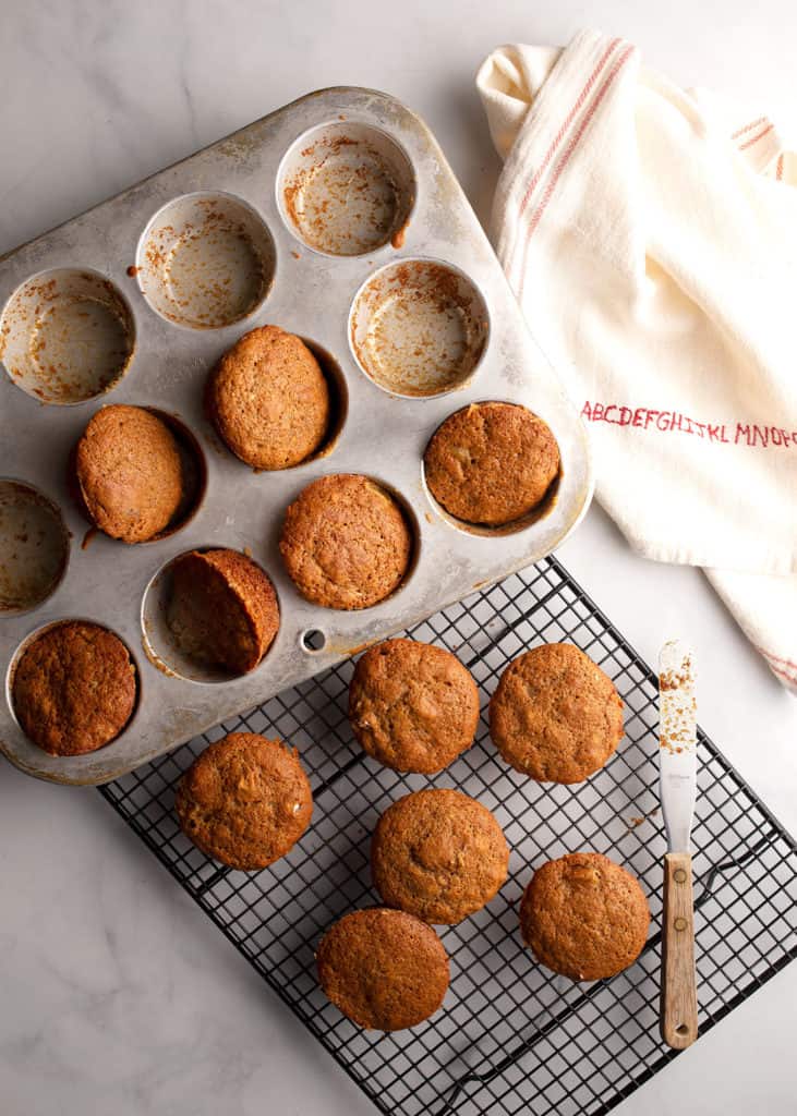Spiced Apple Cider Muffins out of the oven on a rack