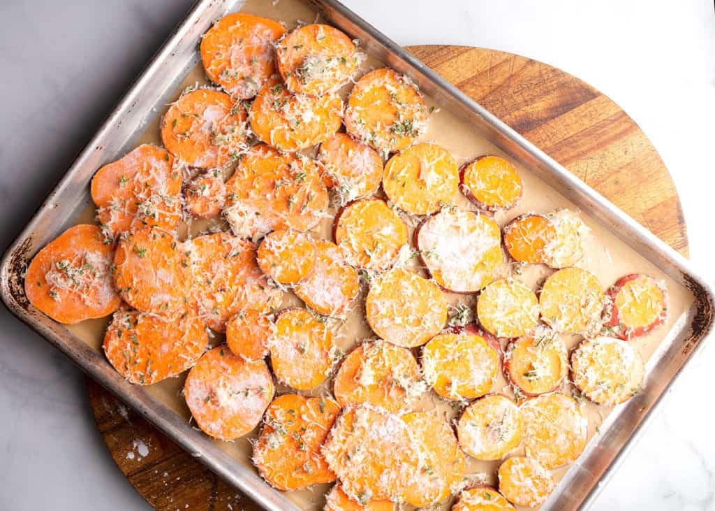 Sweet potato rounds on a baking sheet