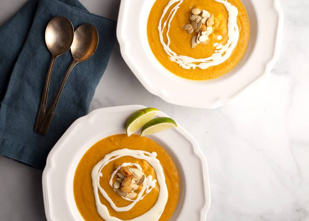 horizontal photo of two servings of Southwest Pumpkin Soup