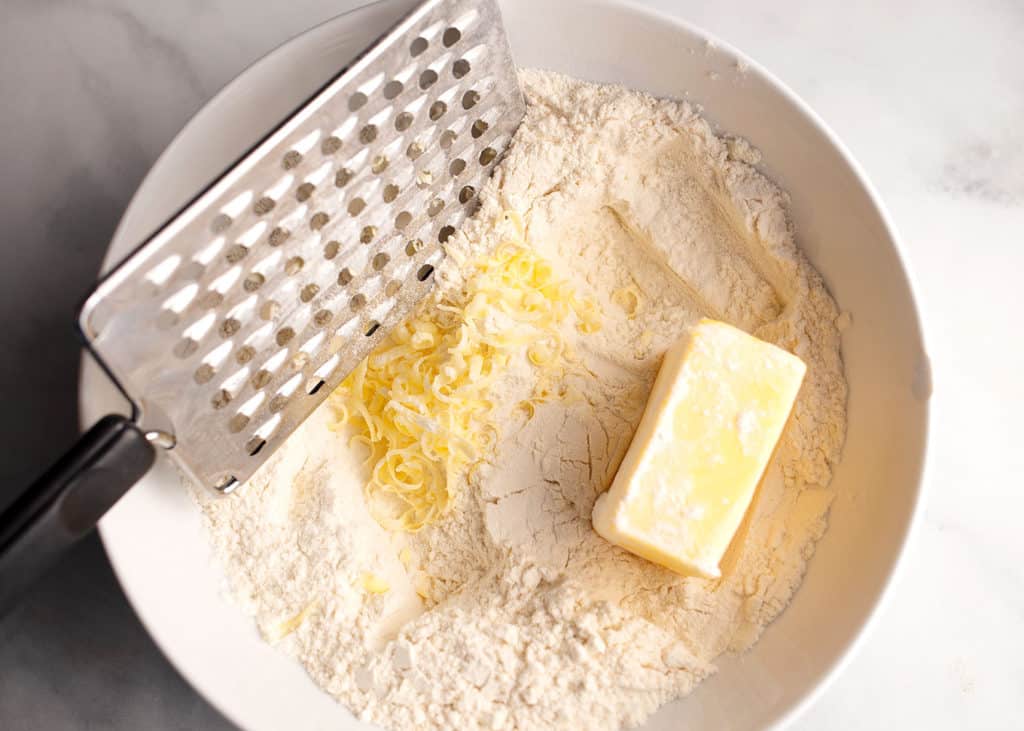 Grating the butter into the flour