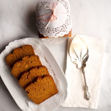 Sliced of Pumpkin Bread on vintage platter with doilies