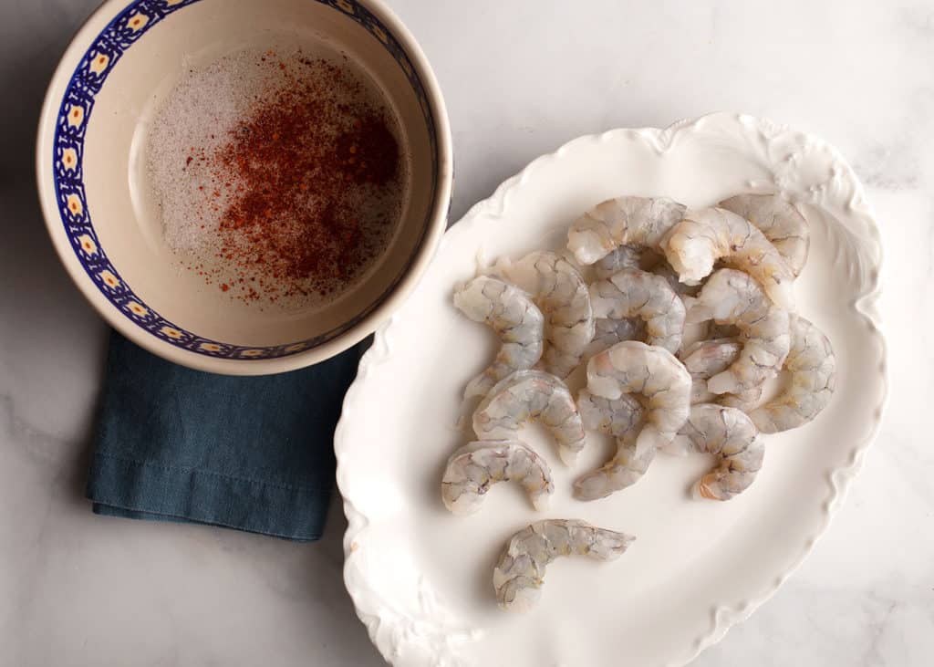 Toss the shrimp with salt and red pepper flakes
