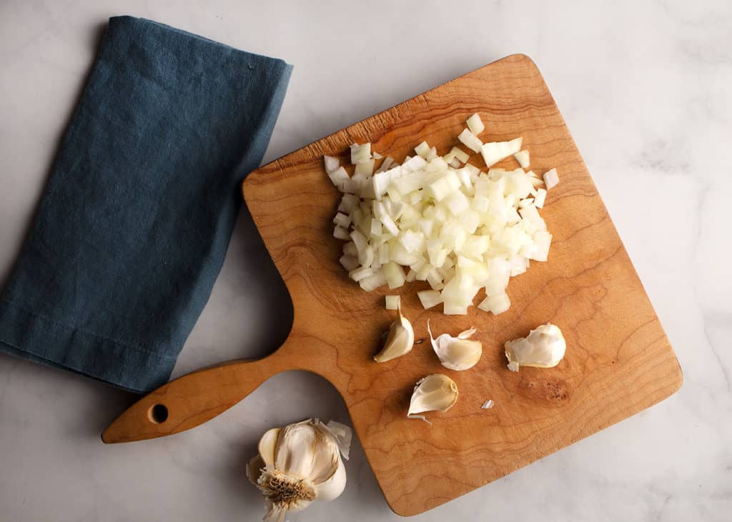 onions and garlic on the cutting board
