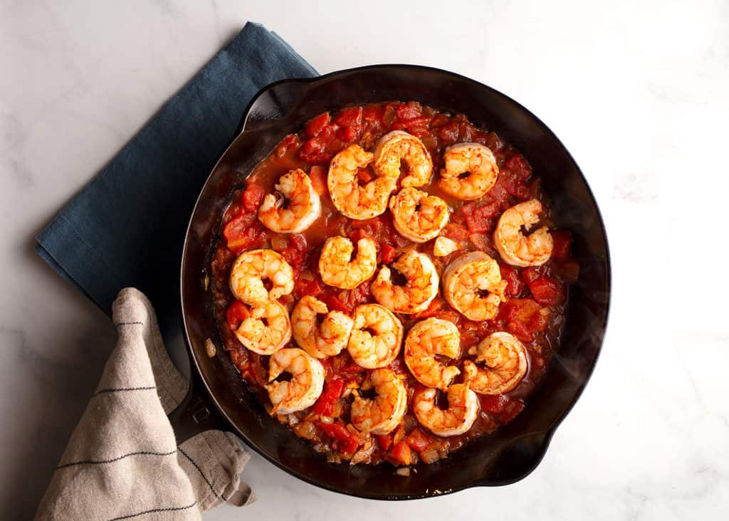 Add the shrimp back in to the tomato sauce