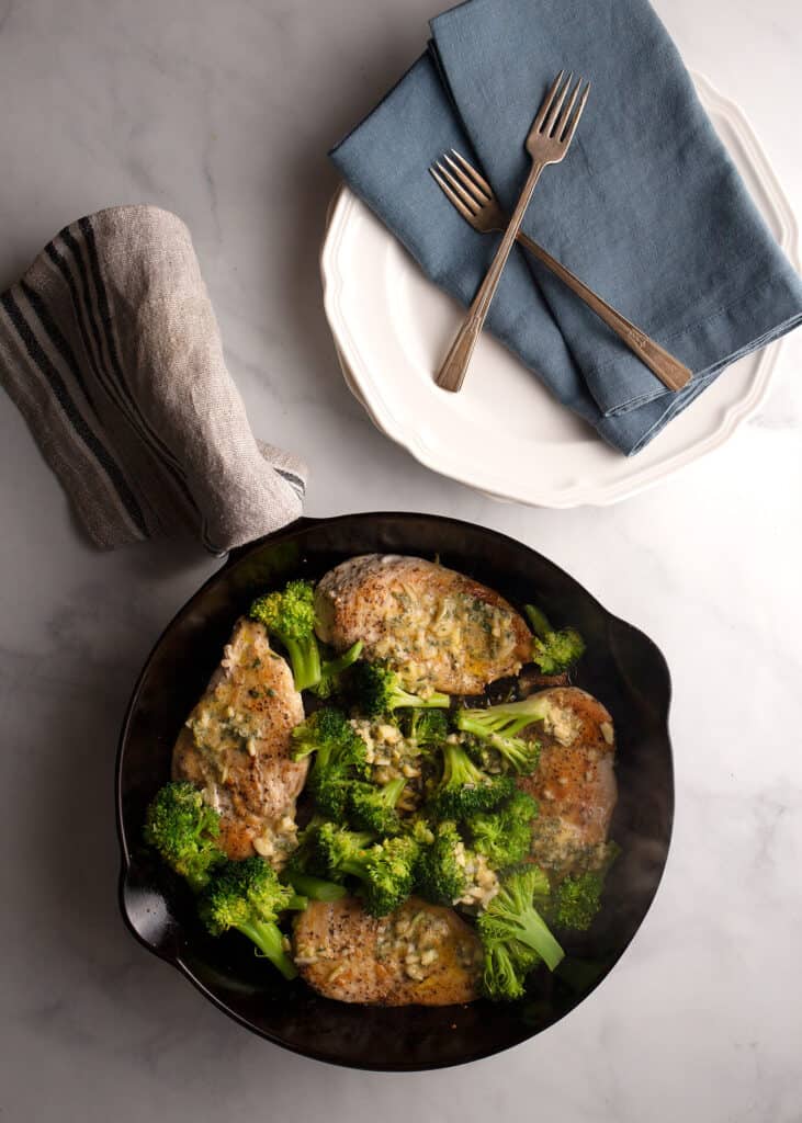 Honey Mustard Chicken Skillet with plates, napkins, and forks