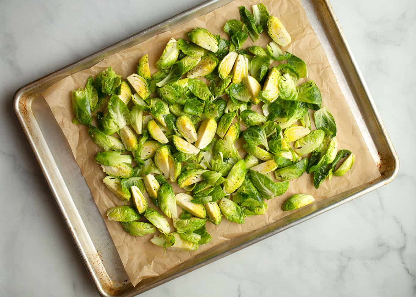 Brussels Sprouts on a parchment paper lined baking sheet