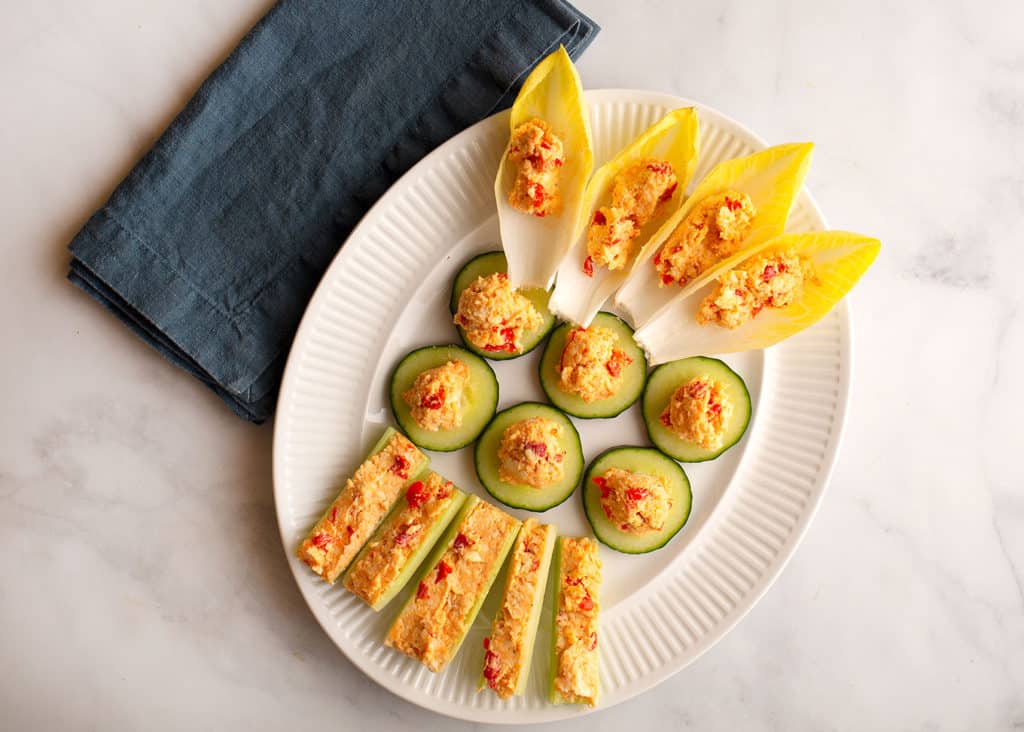 Pimento Cheese on celery, cucumbers, and endive leaves