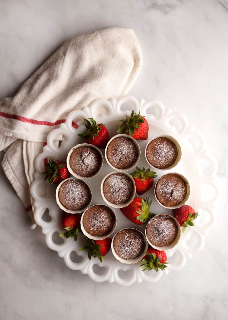 Vintage milkglass platter filled with Double-Boiler Brownies and strawberries