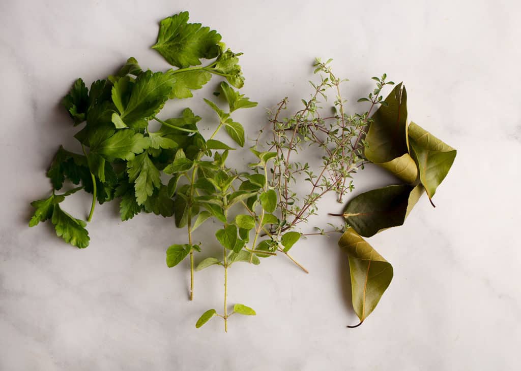 Bay leaves, thyme, oregano, and parsley