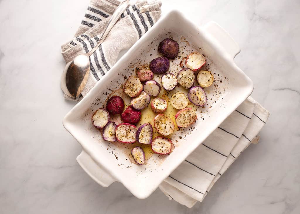 a baking pan of roasted herbed radishes