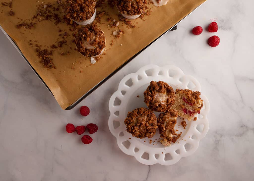 A plateful of raspberry muffins with streusel topping