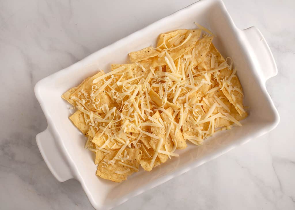 A layer of chips topped with grated cheese