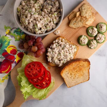 Honey Almond Chicken Salad on a sandwich and cucumber slices