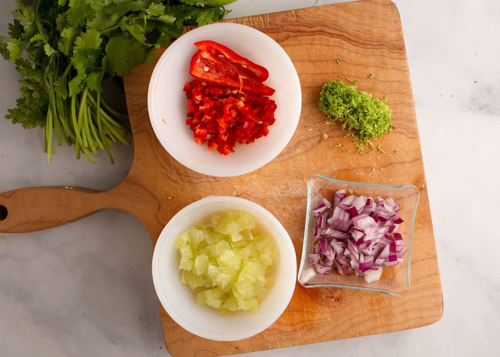 Garnish ingredients: red jalapeno pepper, small diced lime, red onion, cilantro