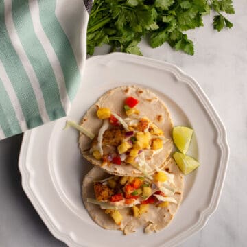 Two Halibut Tacos with Pineapple Salsa on a plate