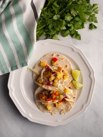 Two Halibut Tacos with Pineapple Salsa on a plate