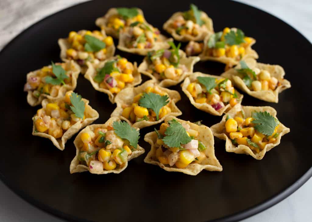 Mexican Street Corn as an appetizer in tortilla chip scoops