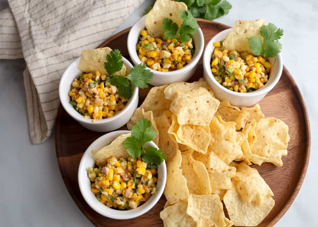 Mexican Street Corn in small bowls with chips