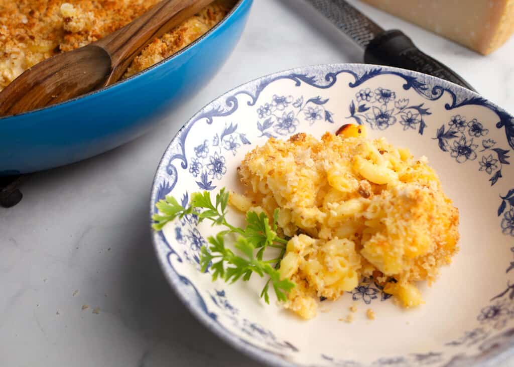 Close up of Baked Buttermilk Mac n' Cheese in a blue and white bowl